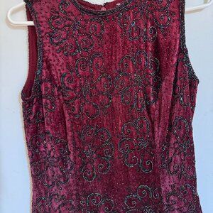 Deep burgundy sleeveless velvet top with intricate beaded embroidery. Full zip.